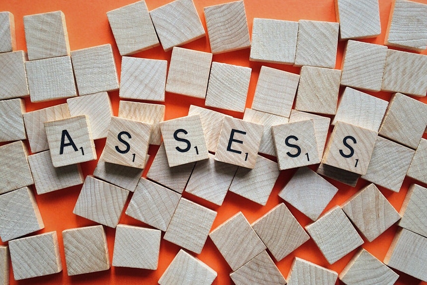 Scrabble tiles forming the word assess to show resume assessment