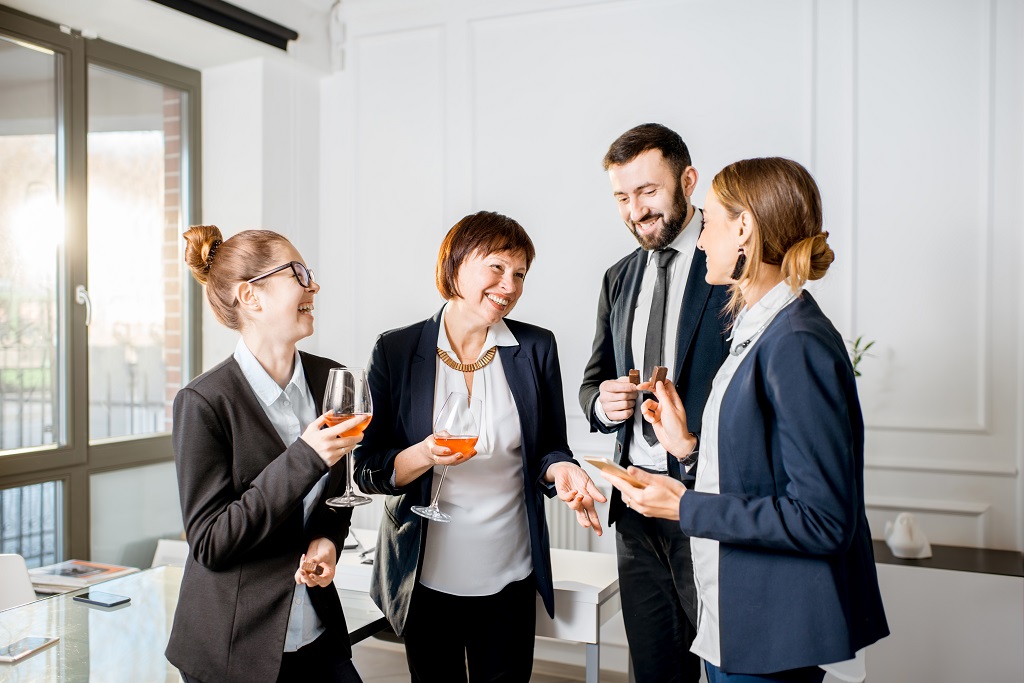 Workmates talking about workplace etiquette