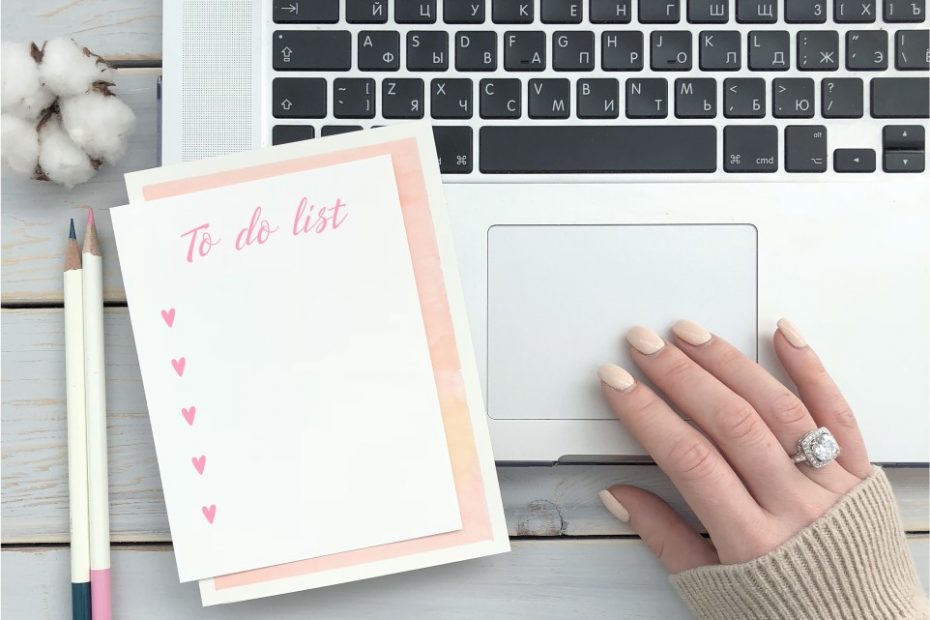 a to do list beside a laptop before writing international resumes