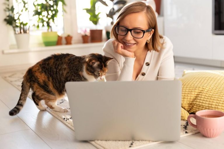 Woman with cat searching for internet-based-jobs