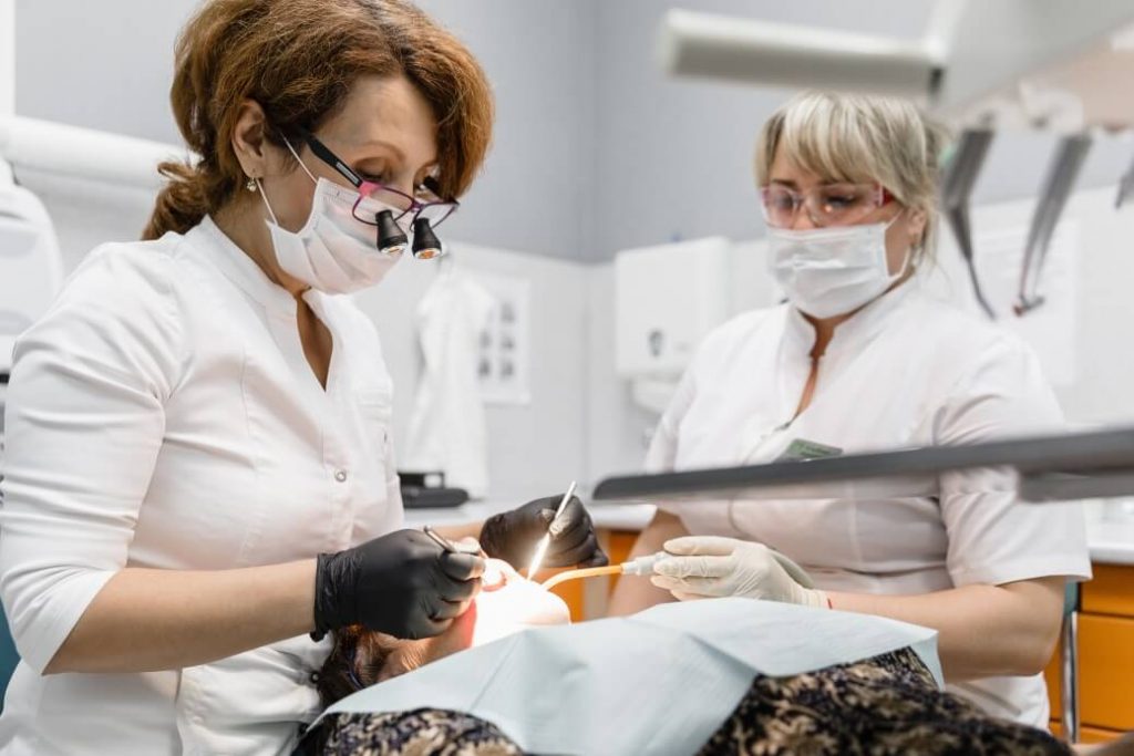 Image of dentist with medical assistant for medical assistant resume