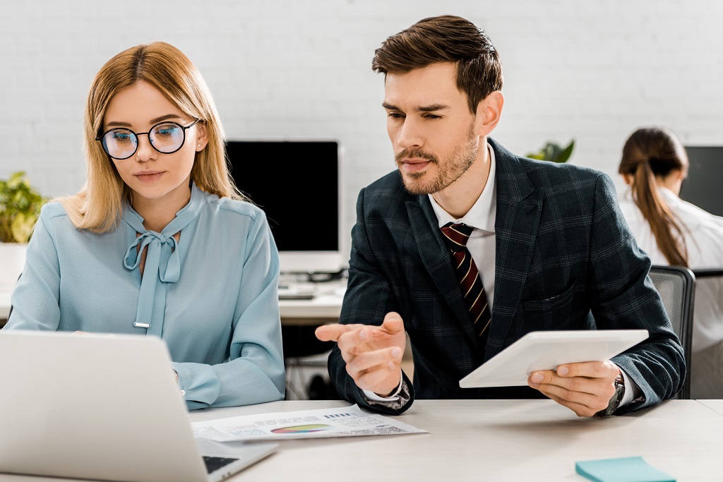 Two colleagues showing workplace professionalism