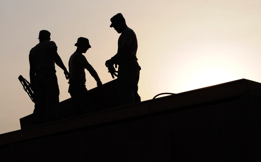 Silhouette of 3 construction laborers as one of the best paying temporary jobs