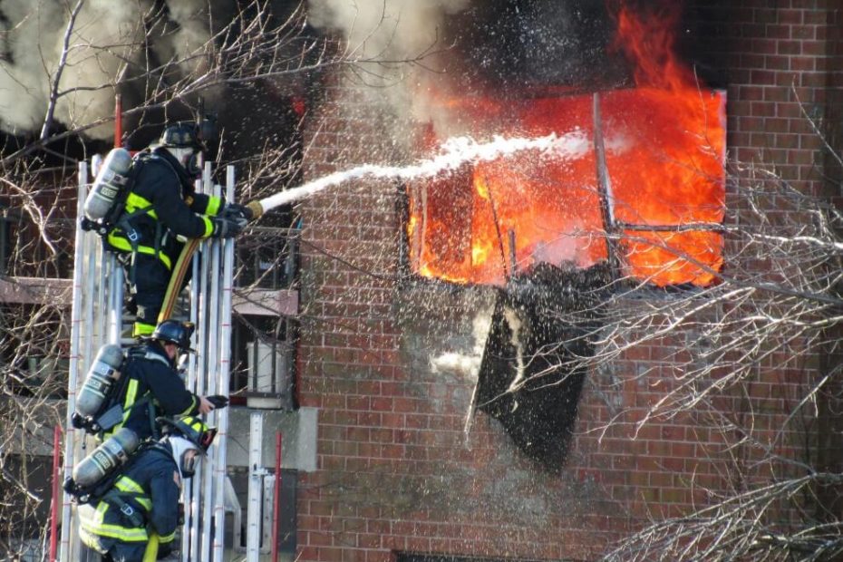 Firefighters extinguishing fire as an example of terrifying jobs