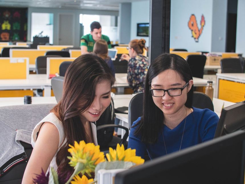 Things on what to look for being discussed by two women inside an office
