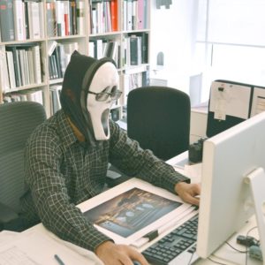 man wearing a mask in front of a computer hiding resume writing truths