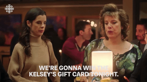 Two employees who think restaurant gift cards are the best Christmas gift ever