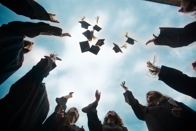 graduate students that throwing graduation hat