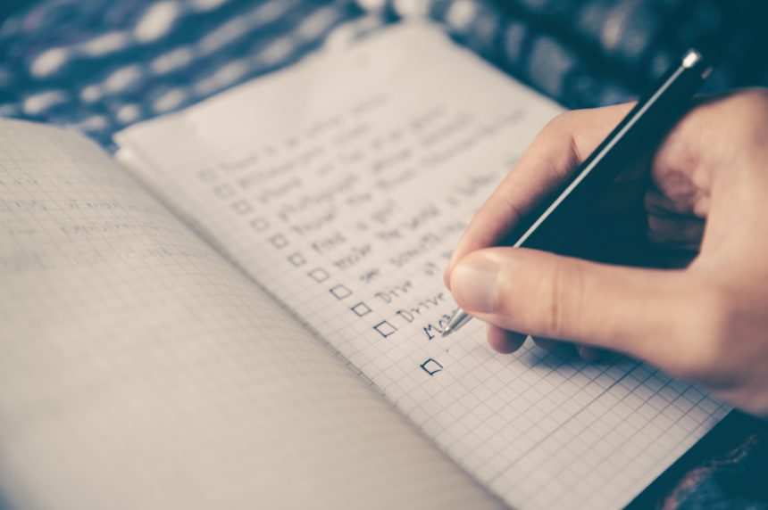 listing resume guidelines with checkboxes in a notebook