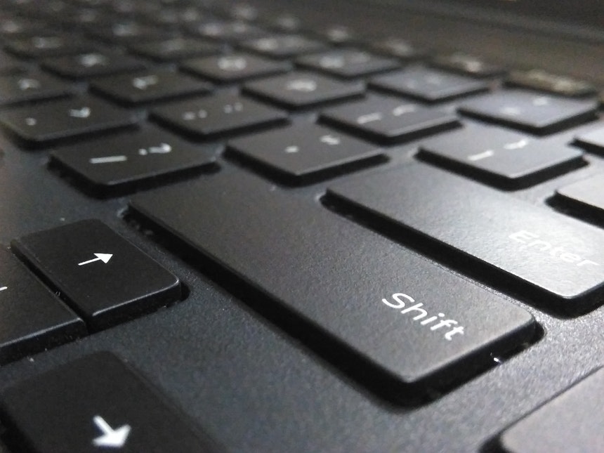 shift button from a laptop keyboard to represent perfect resume for career shifters