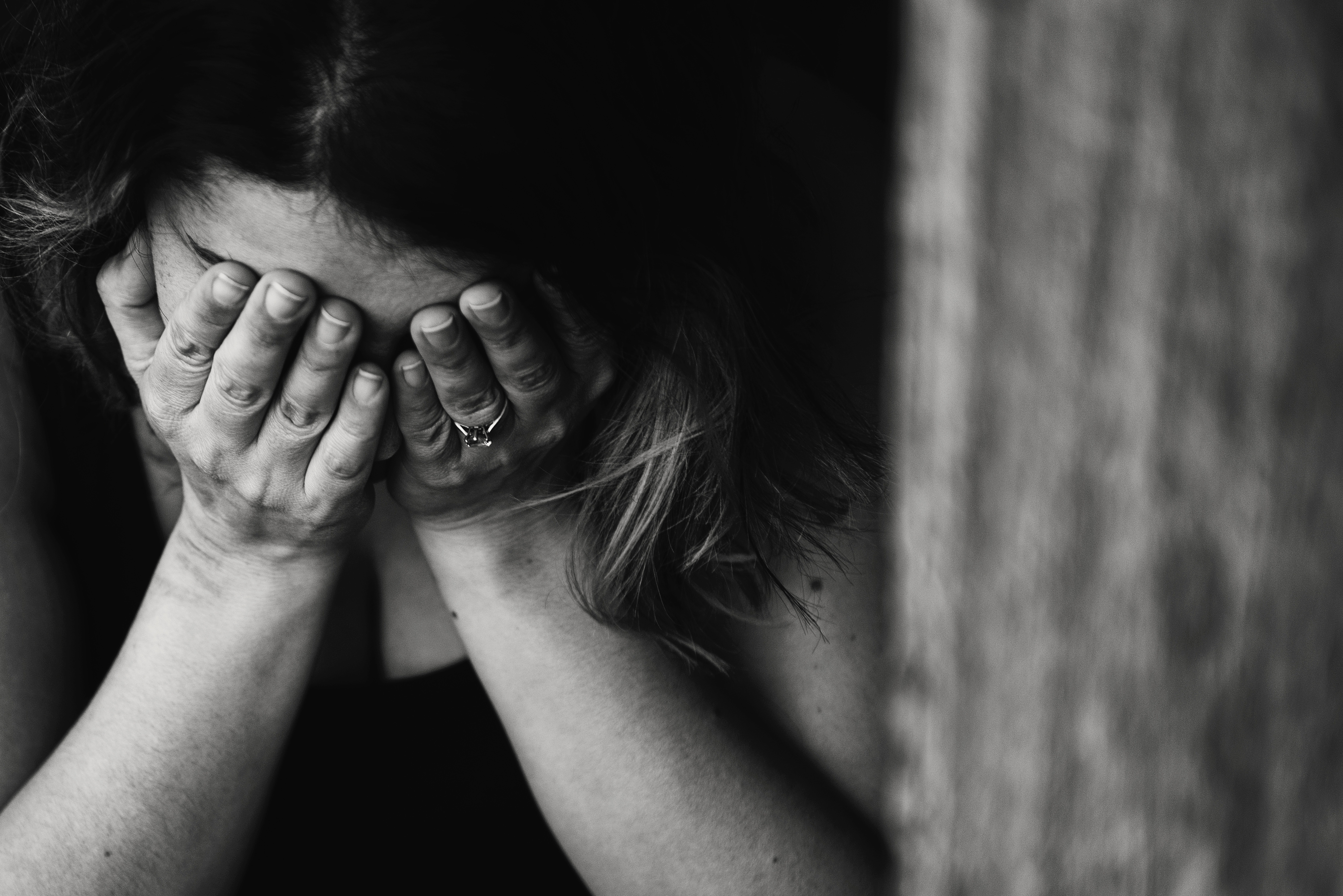 Job Discrimination_Grayscale photo of weeping woman