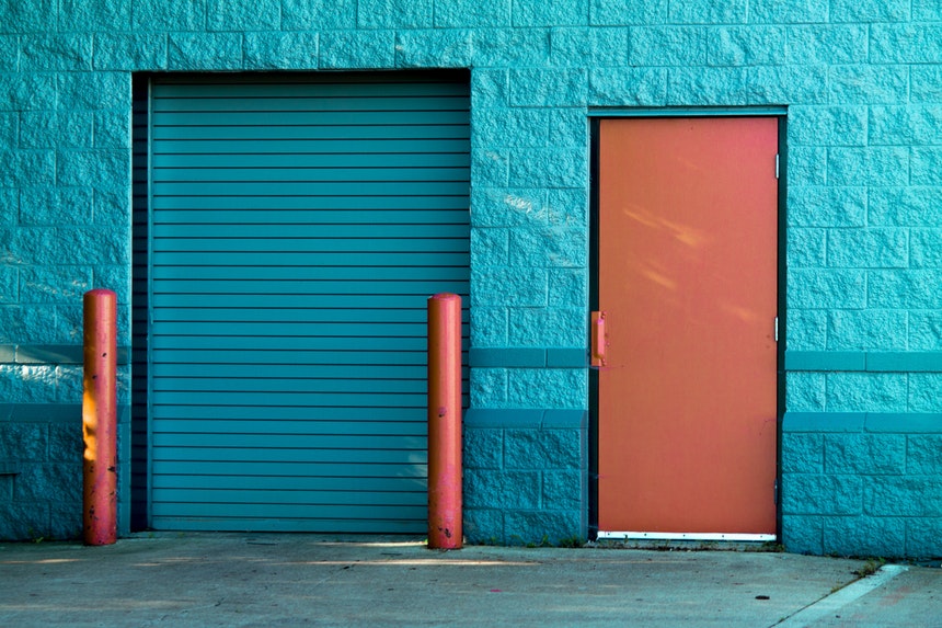 A blue door and a red door which represents the confusion between job or career