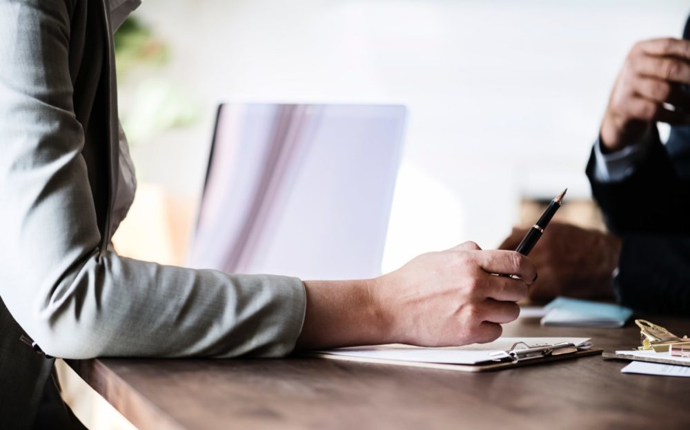 A professional resume writer talking to her client