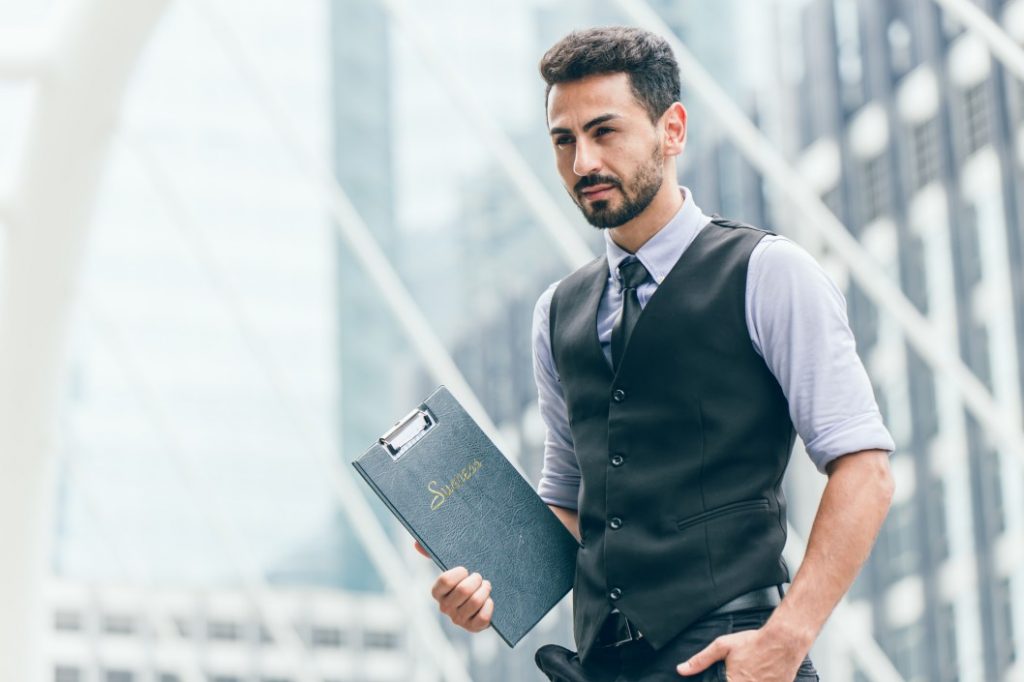 a person holding a folder and is determined to succeed despite job loss