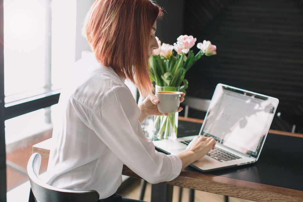 job seeker typing a letter to decline a job offer