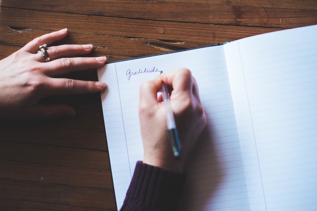 Job seeker writing thank-you letter after job interview