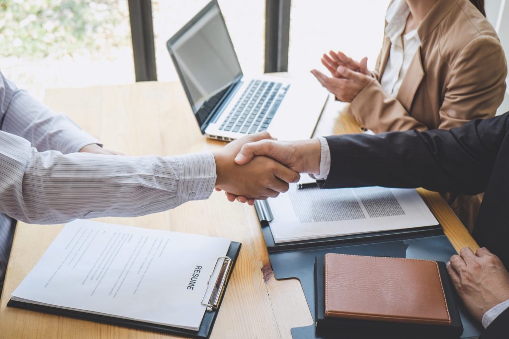 employer-welcoming-interviewee-with-a-hand-shake