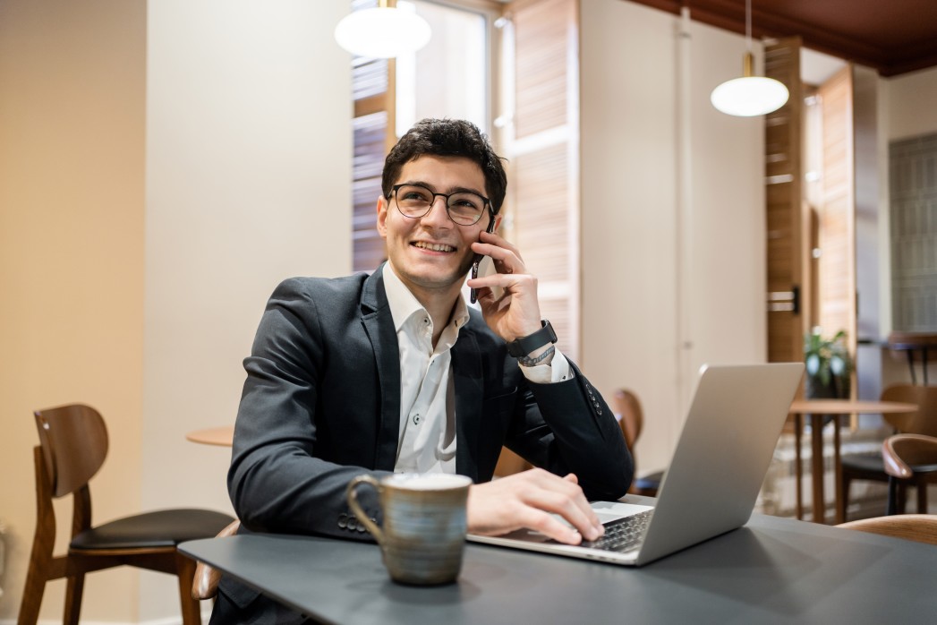 a man happy with the result of online job interview