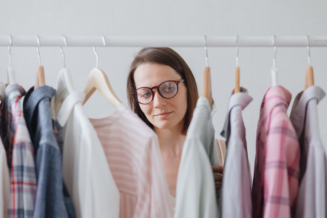 a woman choosing what to wear for online job interview