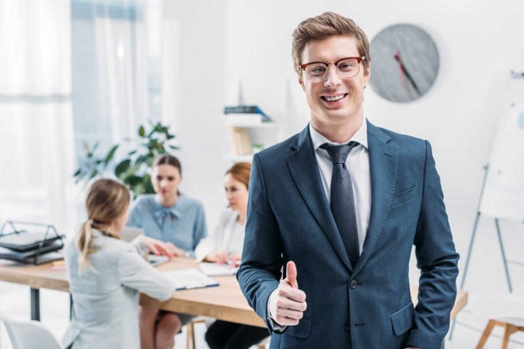 A recruiter giving thumbs up for successful job interview