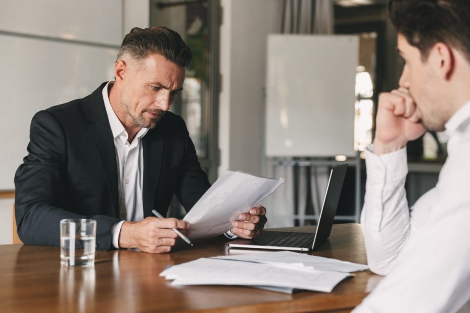 an HR manager reading a resume during an interview