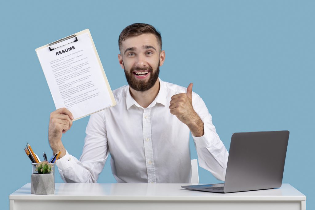 an IT job applicant holding his resume