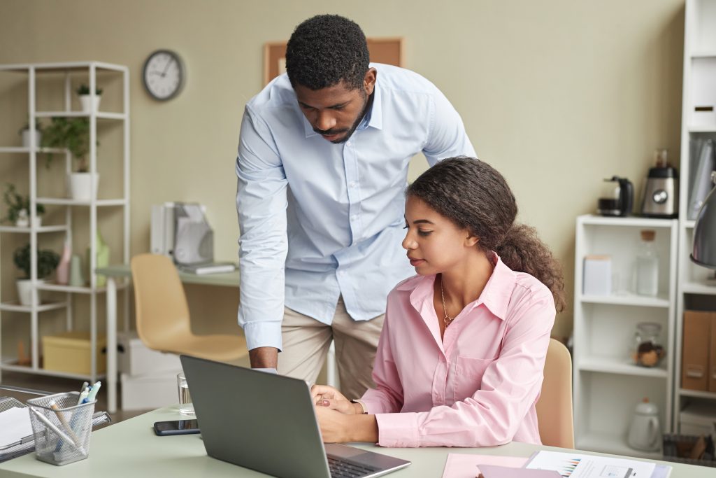 a female employee asking questions to her senior