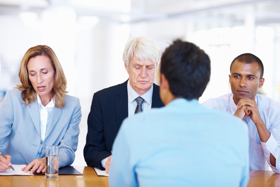 a panel of employers asking an applicant about his ideal workplace
